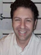 Smiling man with short dark hair